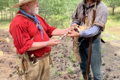 Marvin Woody presenting Shaun Deller the silver tomahawk